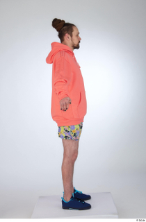 Nigel a-pose blue sneakers dressed floral printed shorts salmon hoodie…